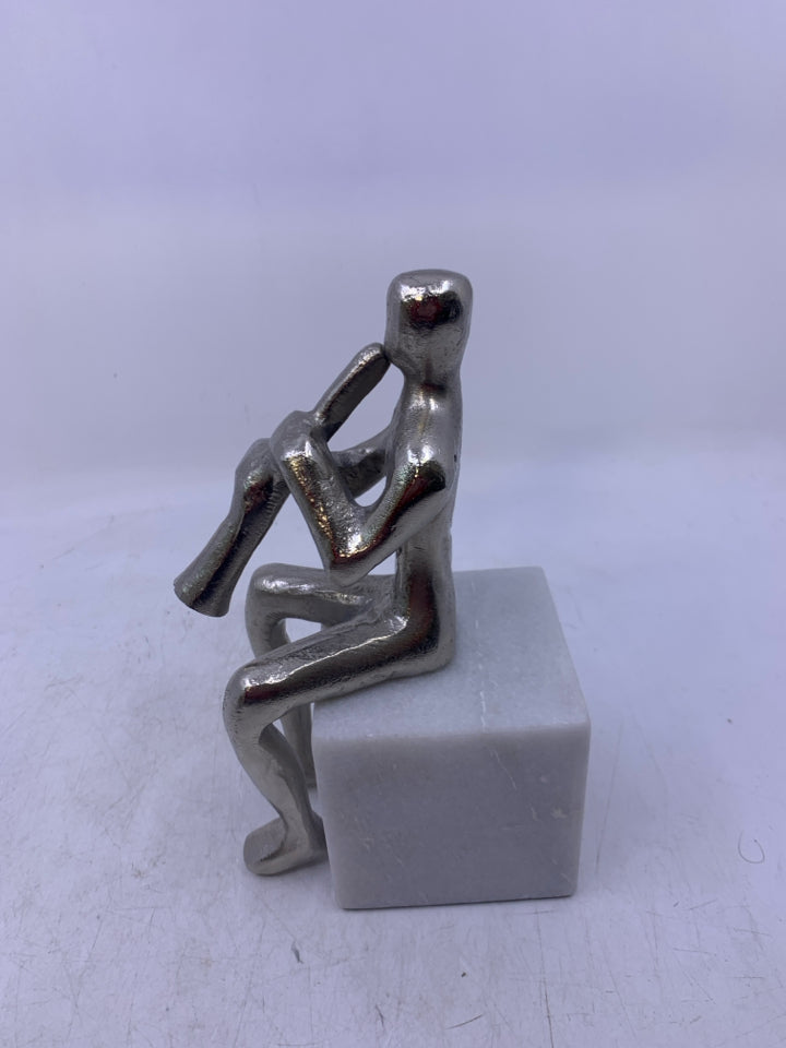 SQUARE MARBLE W/ SILVER METAL MAN PLAYING INSTRUMENT.