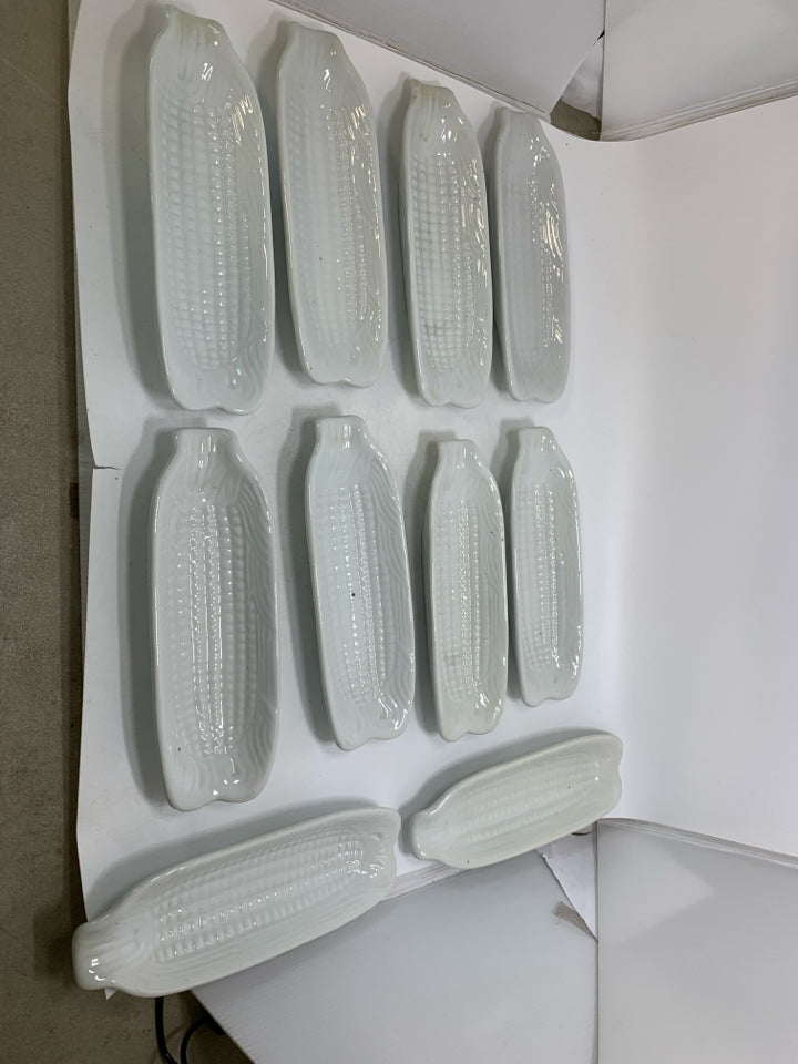 10 WHITE CERAMIC CORN ON THE COB HOLDER PLATES.