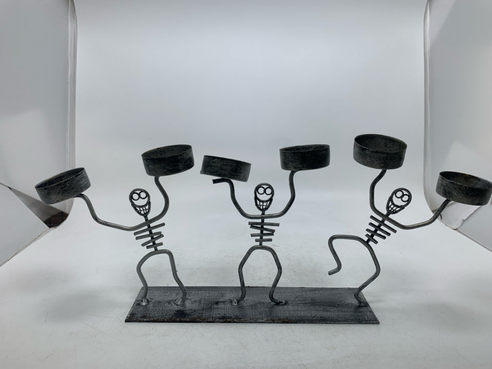 SKELETONS TEA LIGHT HOLDER.