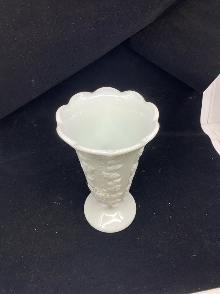 VTG GRAPE PATTERN EMBOSSED FOOTED MILK GLASS VASE.