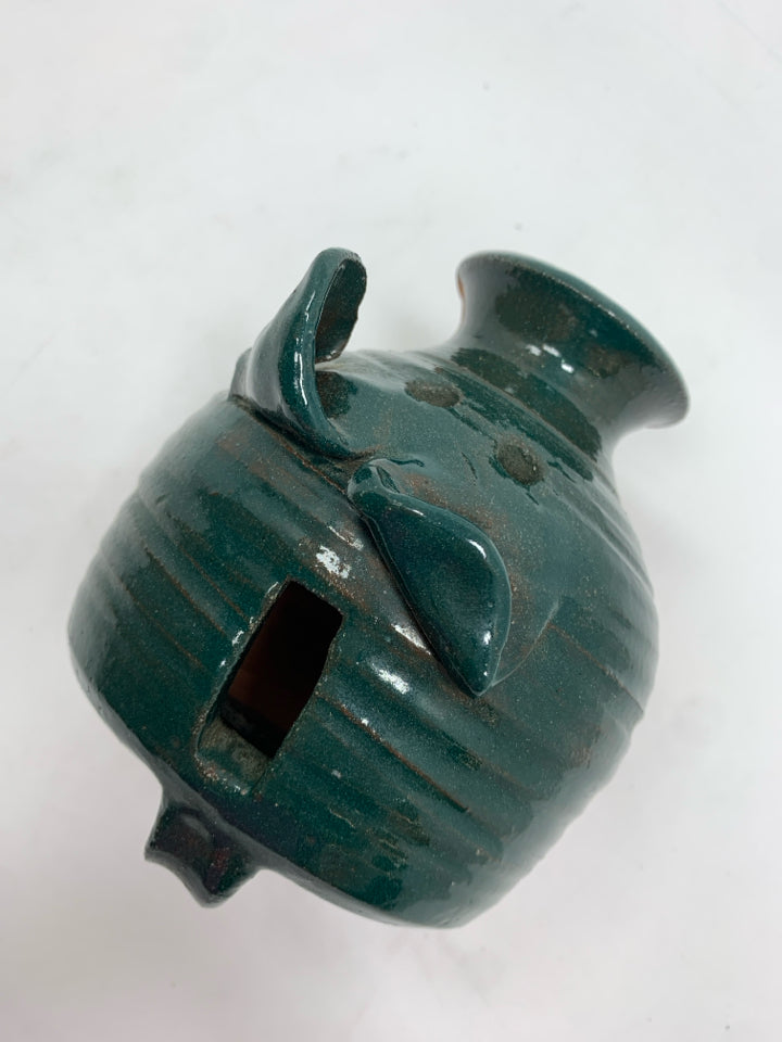 TERRA COTTA PIGGY BANK W/GREEN GLAZE.