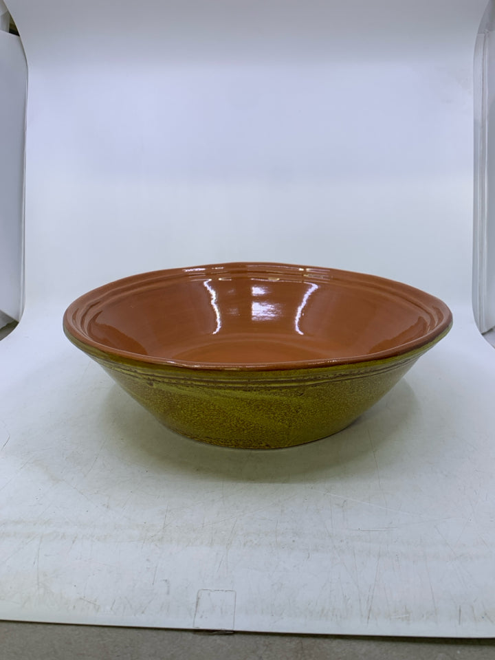 HEAVY TERRA COTTA SERVING BOWL W/ YELLOW OUTSIDE.