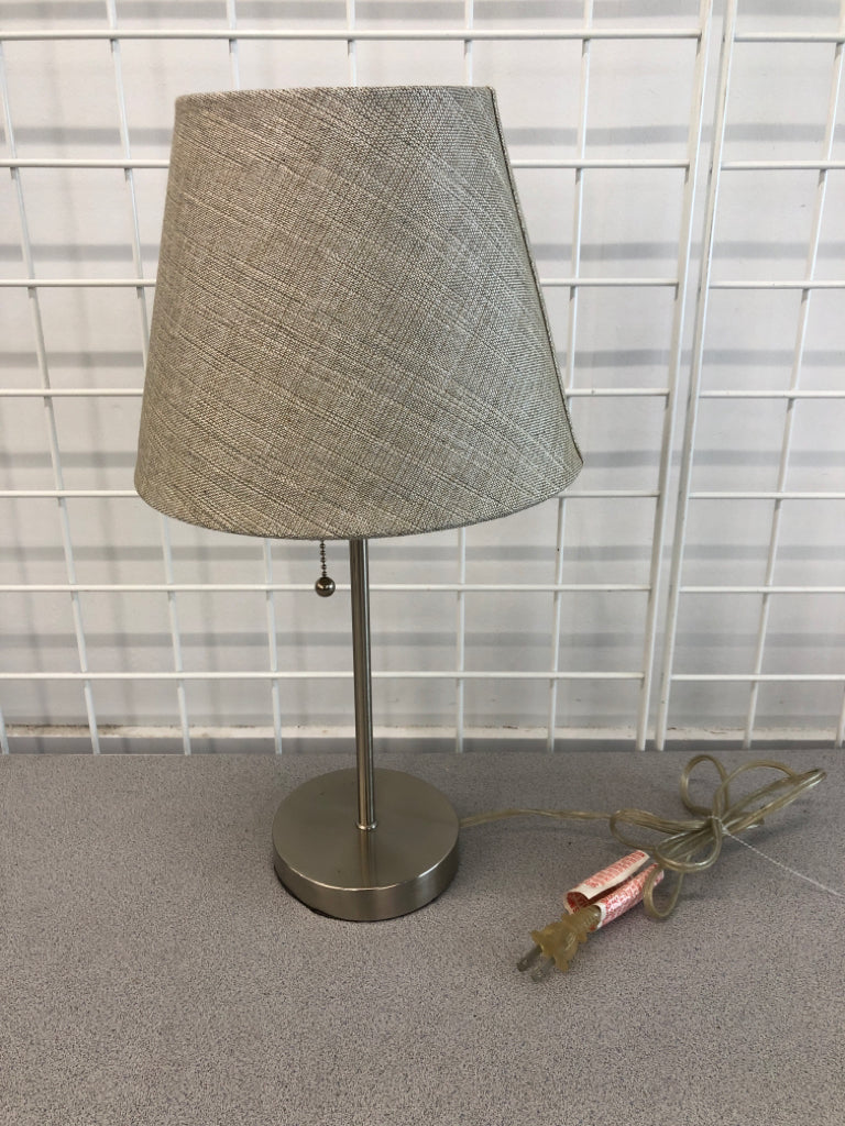 METAL LAMP W/GRAY FABRIC SHADE.
