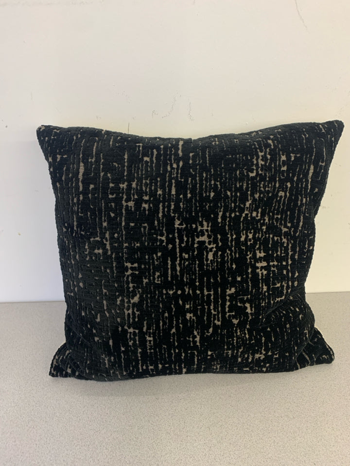 BLACK AND TAN SQUARE PILLOW.