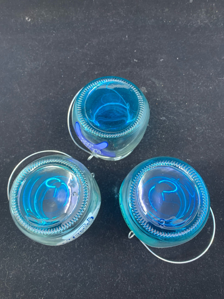 3 BLUE TEA LIGHT HOLDERS.