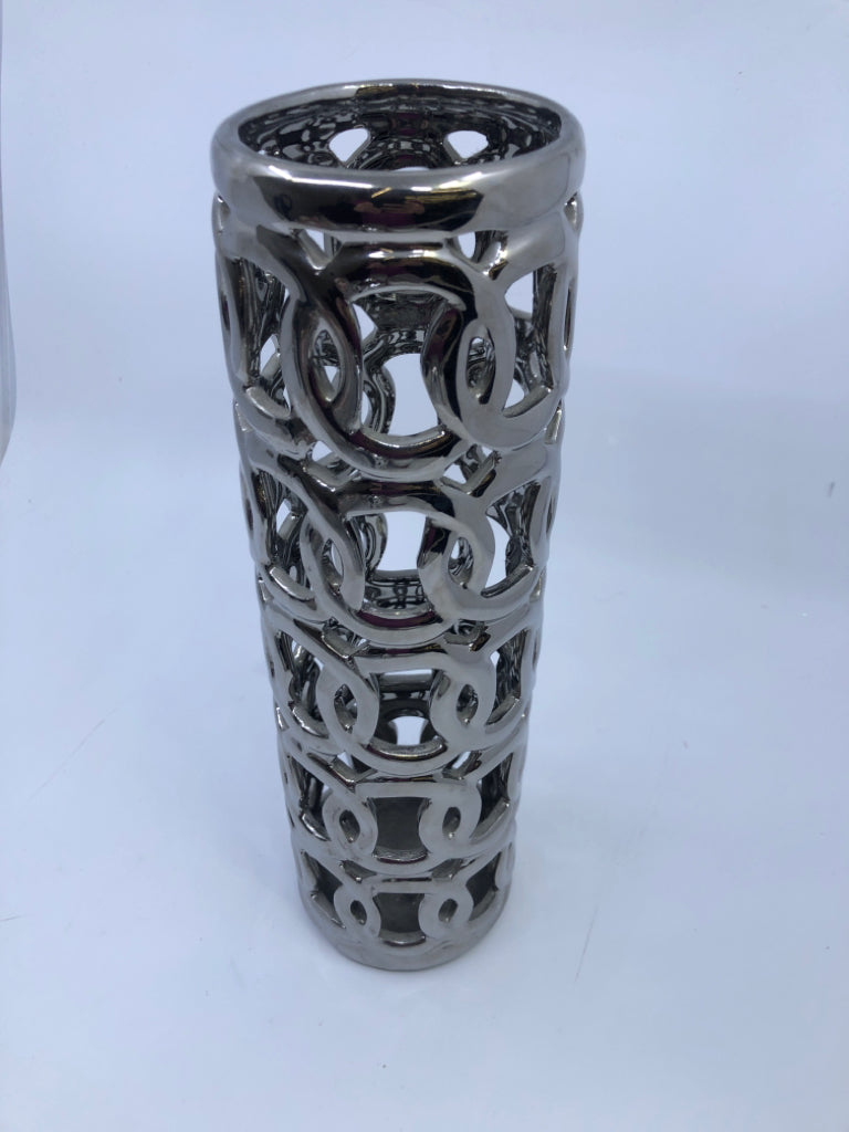 TALL SILVER PIERCED VASE.