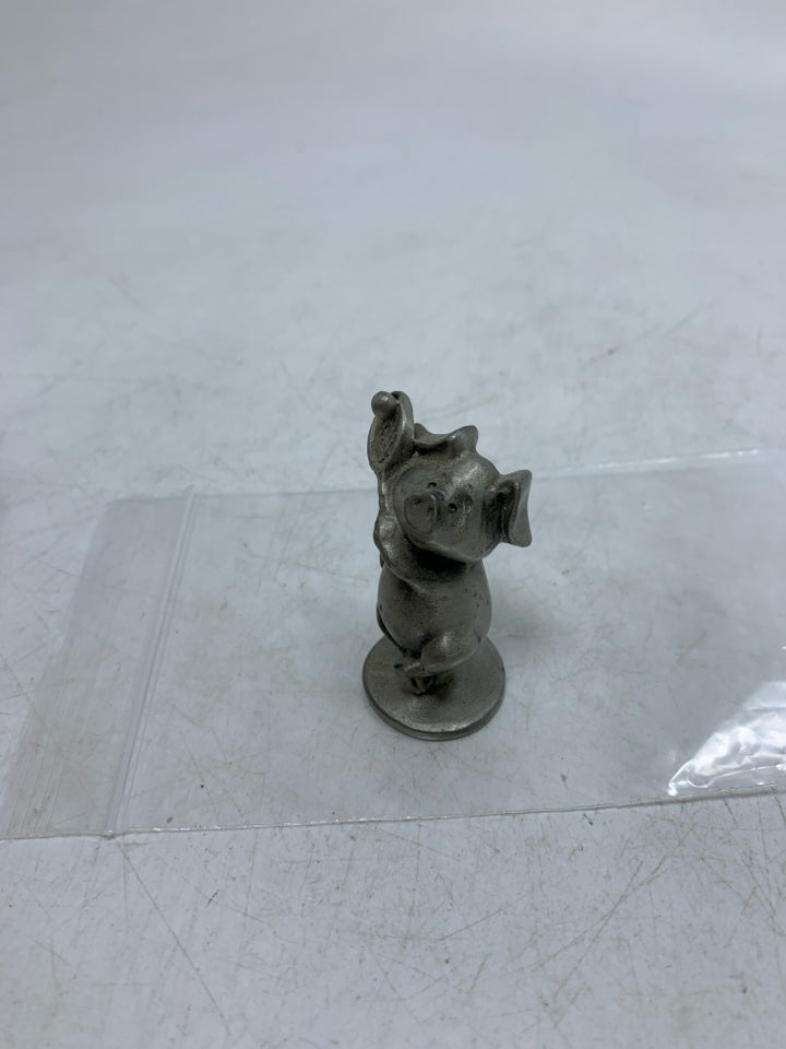 MINI PIG HOLDING TENNIS RACKET FIGURINE.