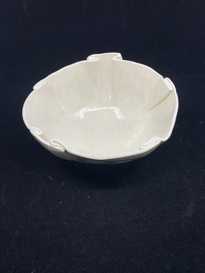 CREAM SPECKLED POTTERY BOWL W/ ASSORTED HEARTS FOLDED EDGES.