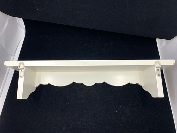 WHITE WALL SHELF W/ SCALLOP DESIGN.