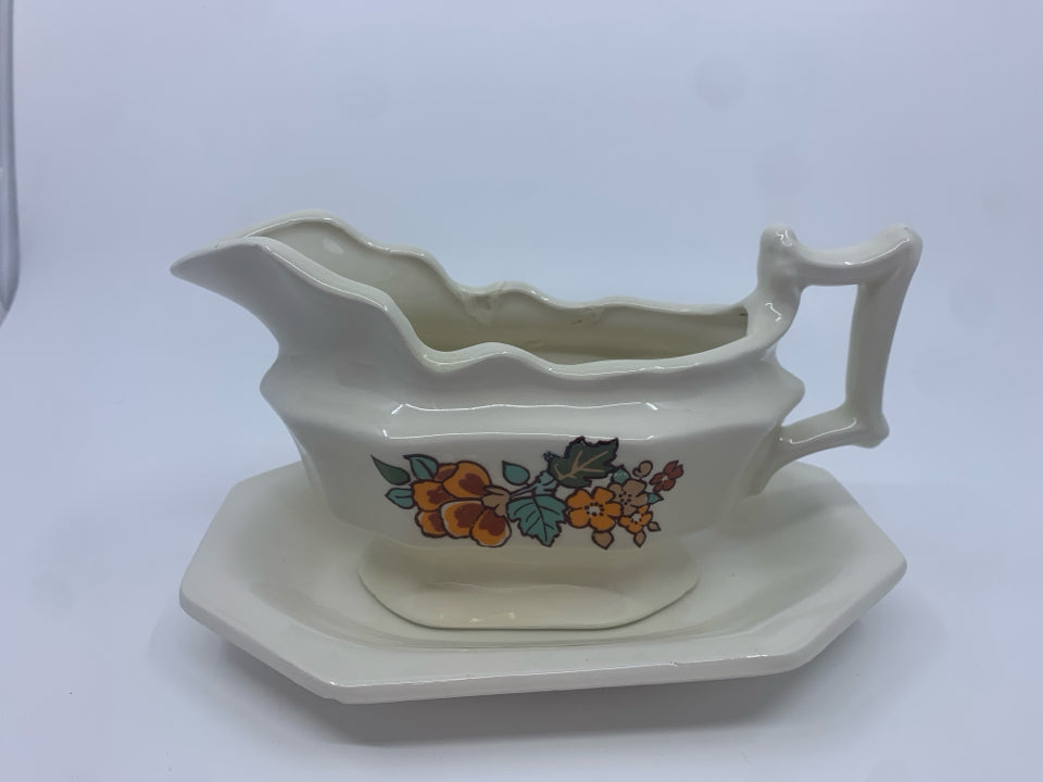 CREAM W ORANGE FLORAL GRAVY BOAT AND PLATE.