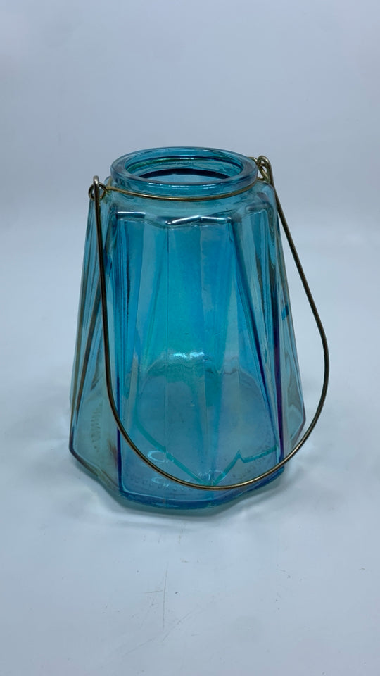 BLUE IRIDESCENT CANDLE HOLDER W/HANDLE.