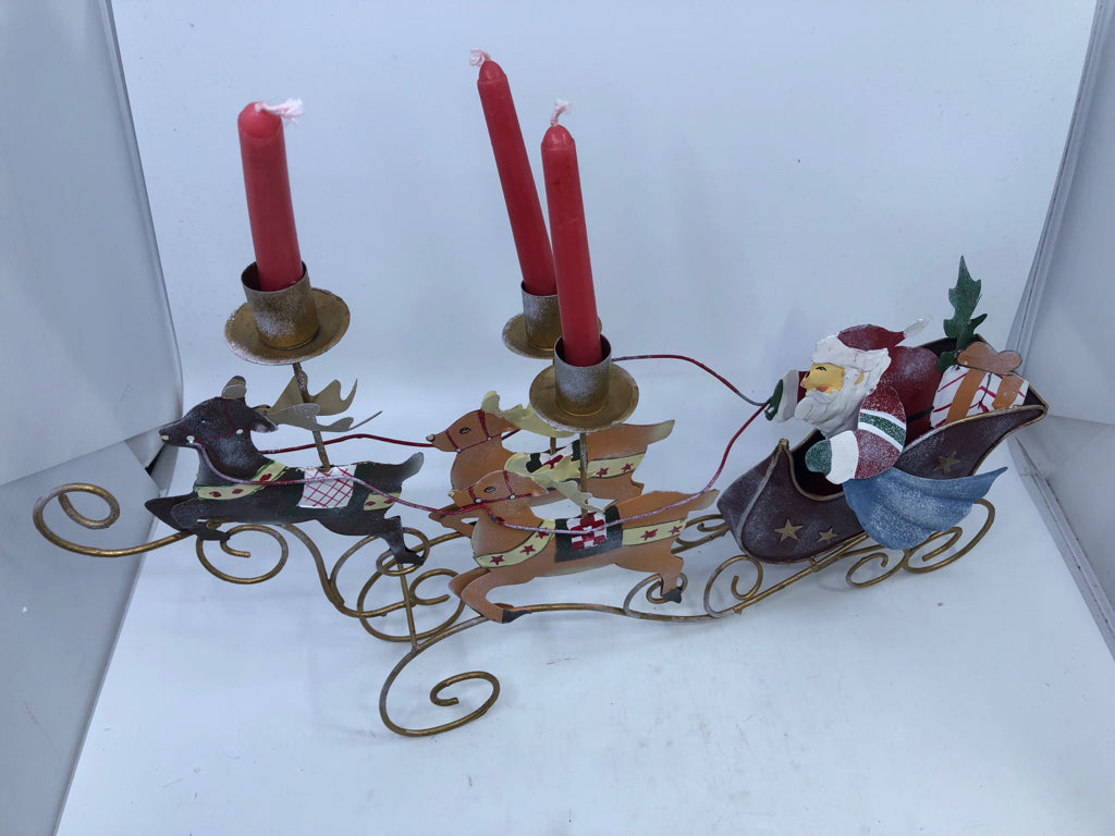METAL SANTA IN SLEIGH CANDLE HOLDER.