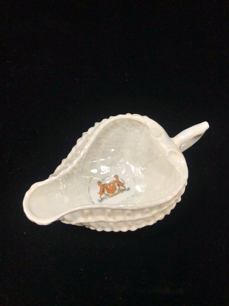 PEARLESCENT FOOTED SEASHELL DISH W/HANDLE.