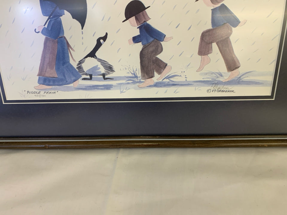 PUDDLE PICKIN KIDS WALKING THROUGH THE RAIN FRAMED SIGNED PRINT.