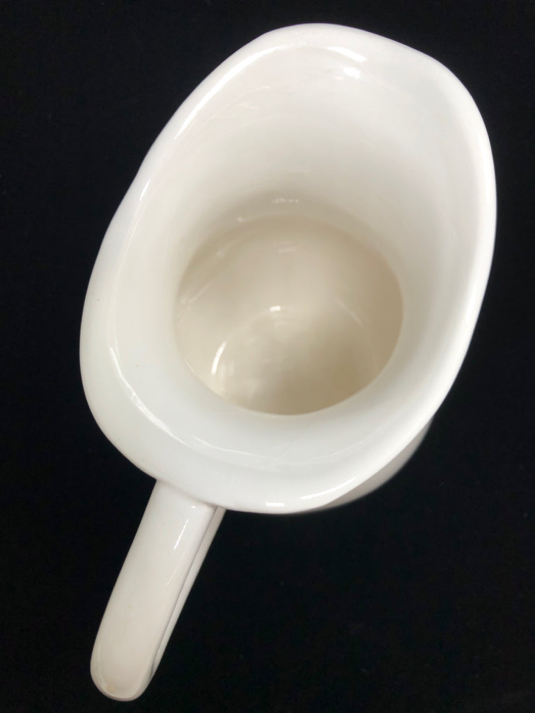 WHITE CERAMIC PITCHER.