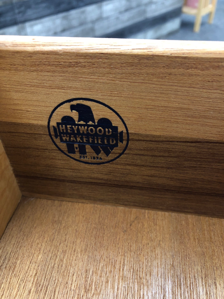 VTG WOOD SIDE TABLE W/3 DRAWERS ON WHEELS.