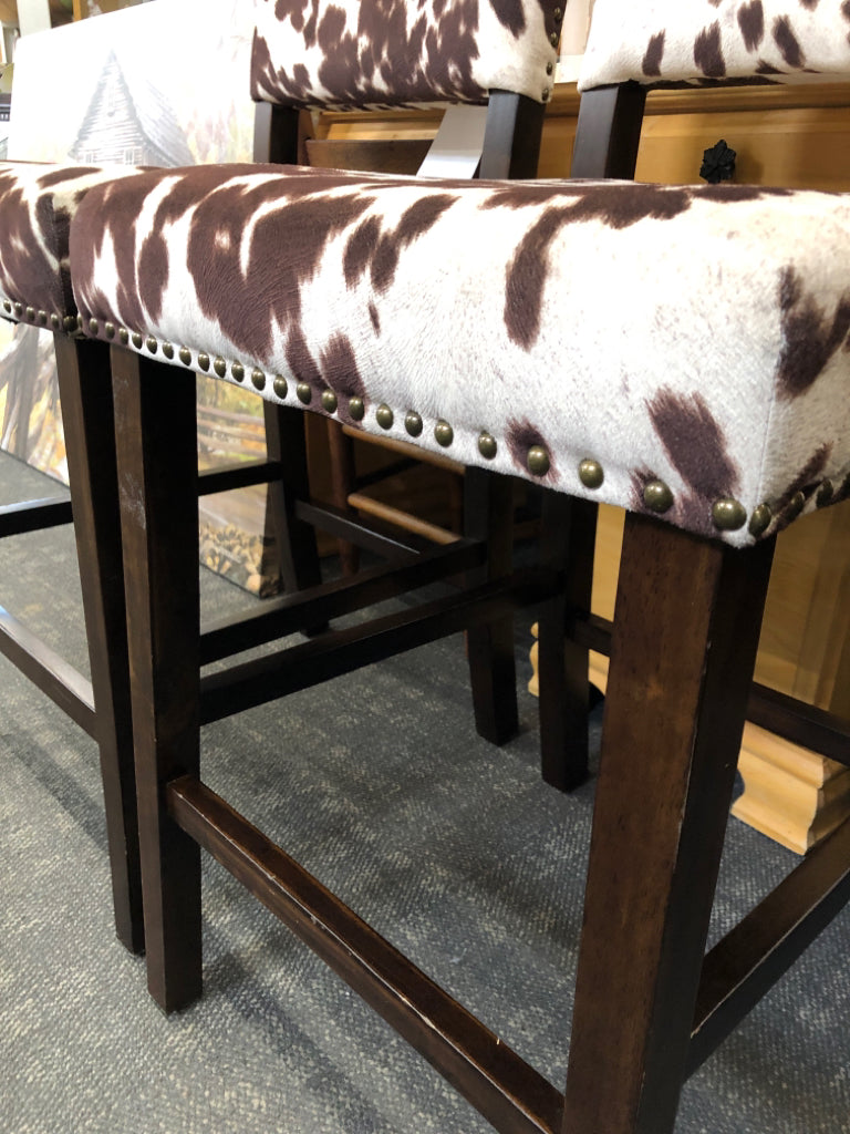 2-FAUX COW HIDE DARK WOOD STOOLS.