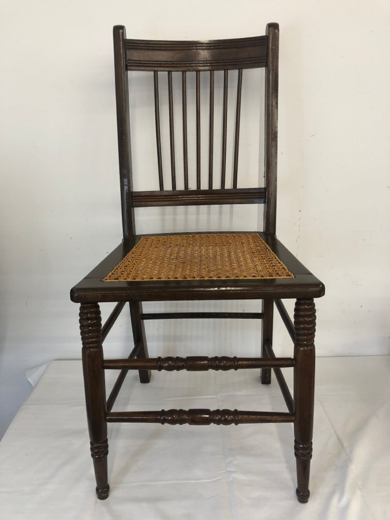 VTG DARK WOOD ACCENT CHAIR W TAN SEAT.