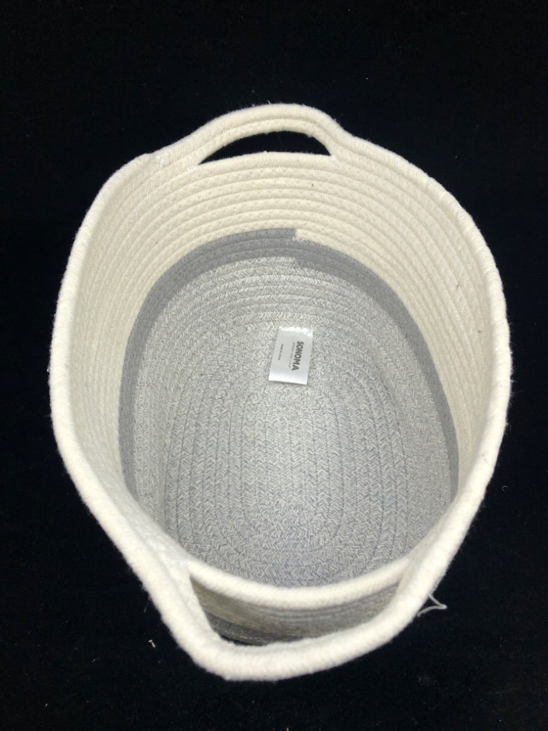 GREY AND WHITE WOVEN BASKET W HANDLES.