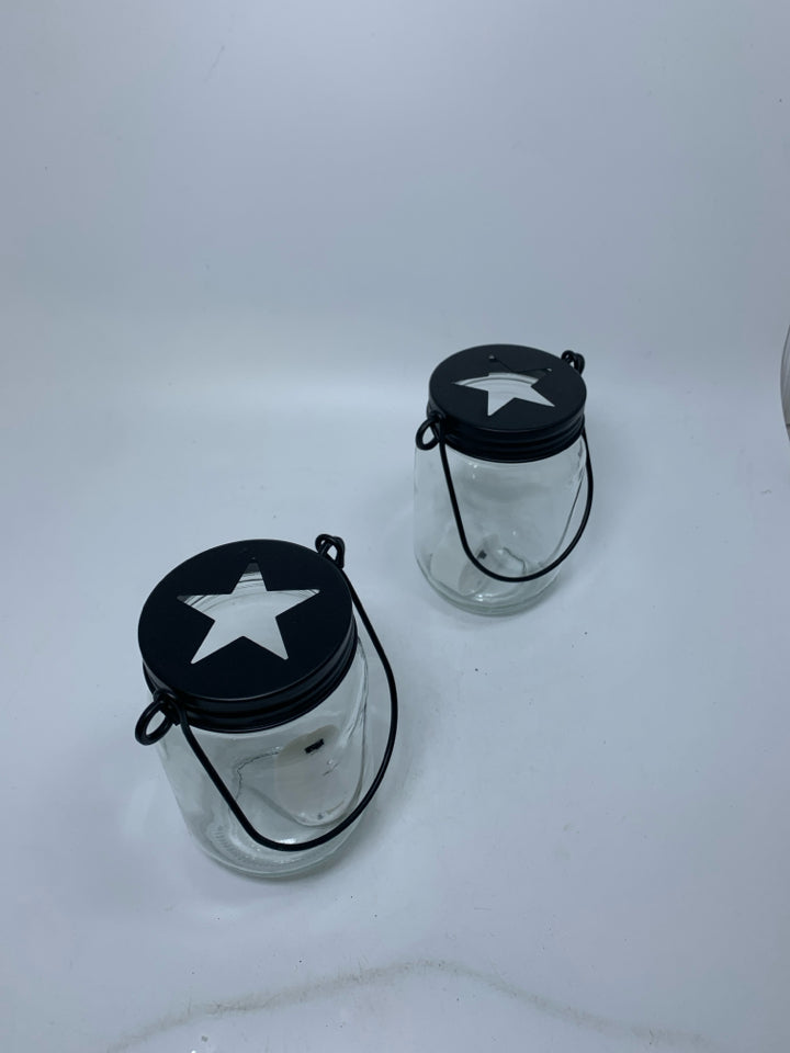 2 GLASS MASON JAYS W/ STAR CUT OUT CAP LANTERN.