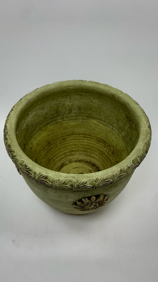GREEN CEMENT PLANTER W/EMBOSSED FLOWERS.