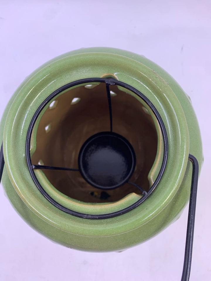 GREEN CERAMIC PIERCED CANDLE LANTERN.