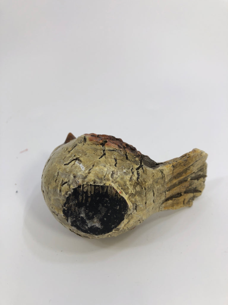 SMALL TEXTURED BROWN BIRD.