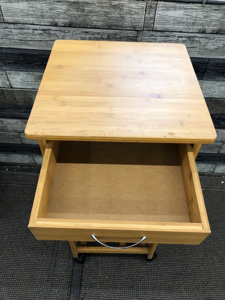 ROLLING WOODEN STORAGE CABINET.