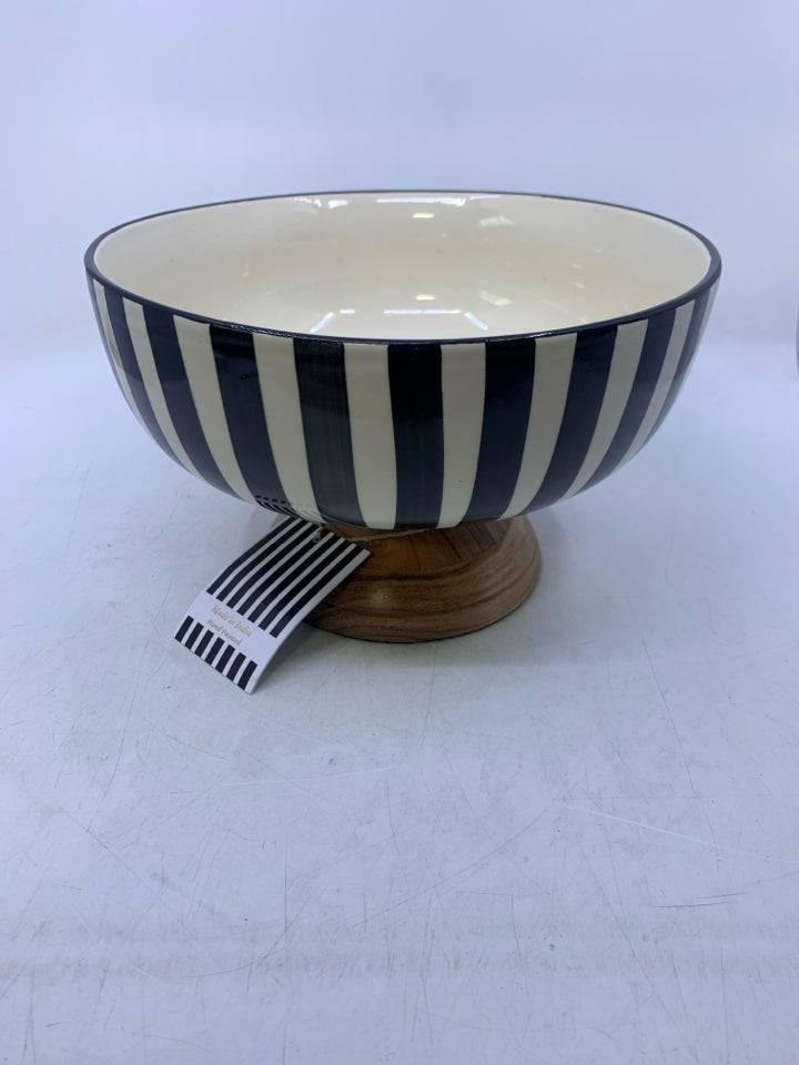 WOOD FOOTED BASE W/ BLACK/WHITE STRIPED CERAMIC BOWL.