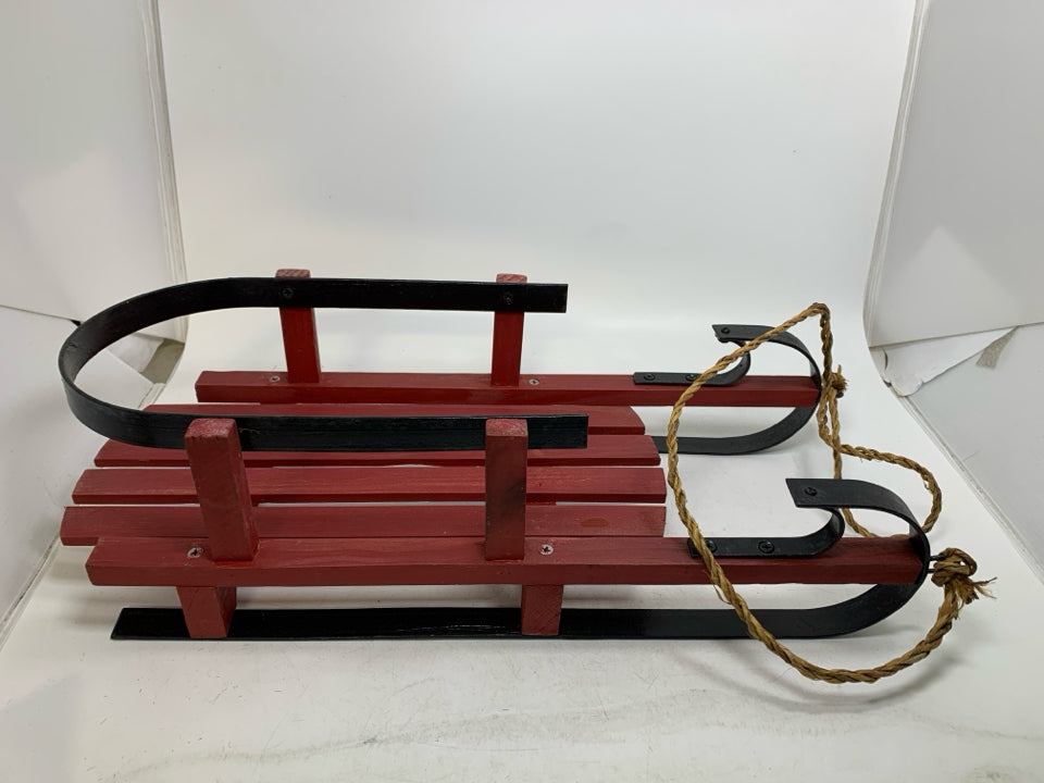 HEAVY WOOD RED SLED W/ METAL FEET.