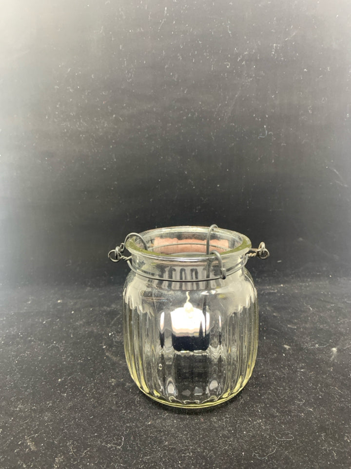 GLASS JAR W BLACK TEA LIGHT HOLDER ACCENT AND HANDLE.