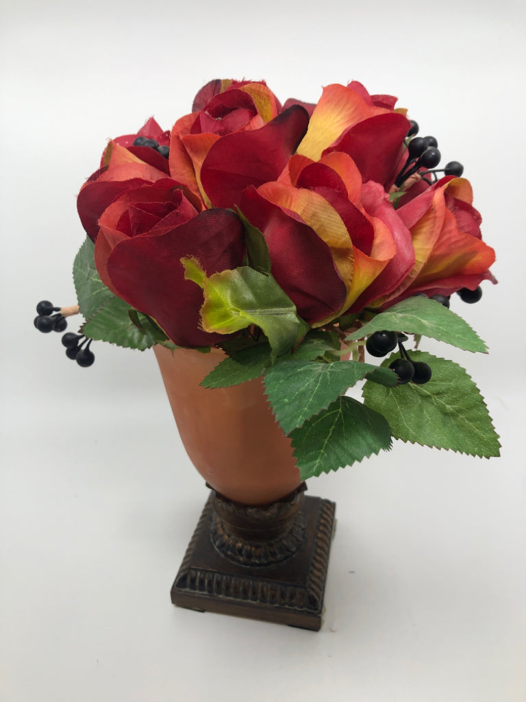 RED FLORALS IN FROSTED ORANGE PEDESTAL VASE.