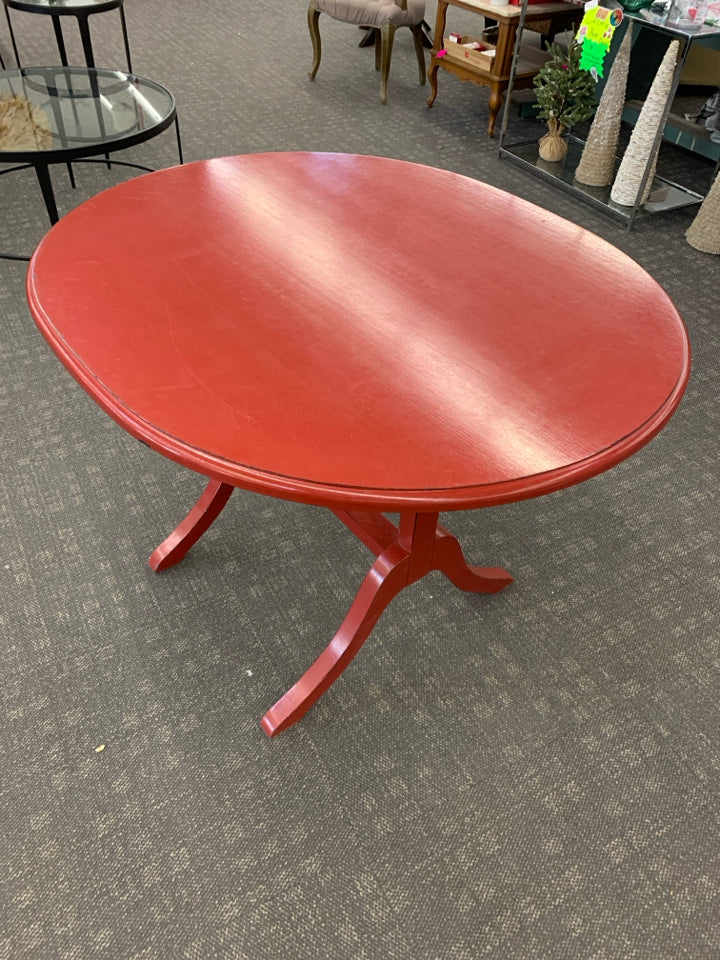 OVAL RED FLIP TOP TABLE.