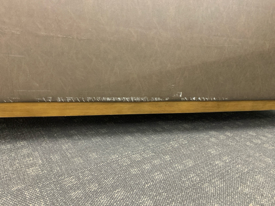 BROWN FAUX LEATHER COUCH.