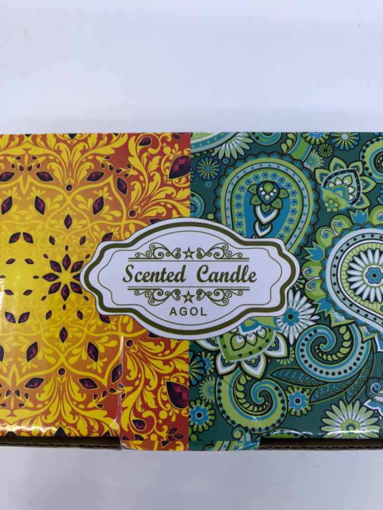 2 NIB SCENTED TIN CANDLES.