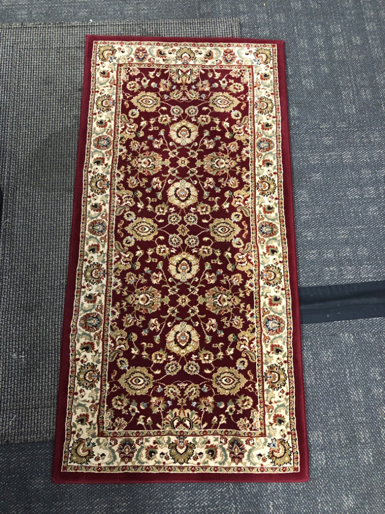 RED AND FLORAL ORIENTAL RUG.