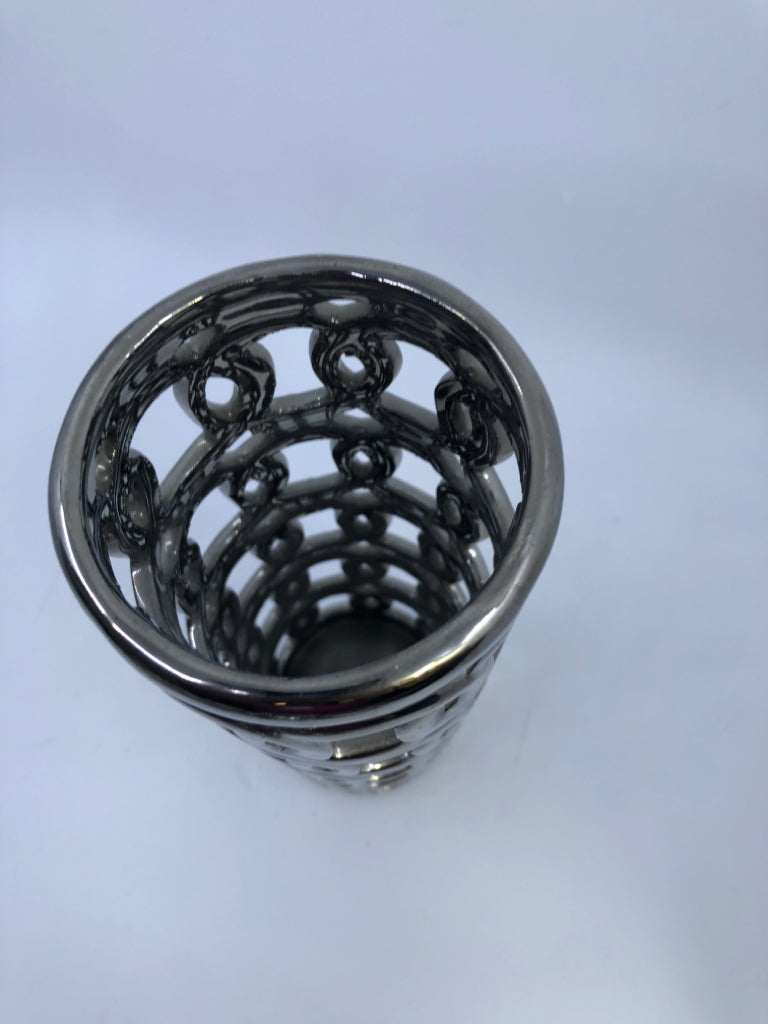 TALL SILVER PIERCED VASE.