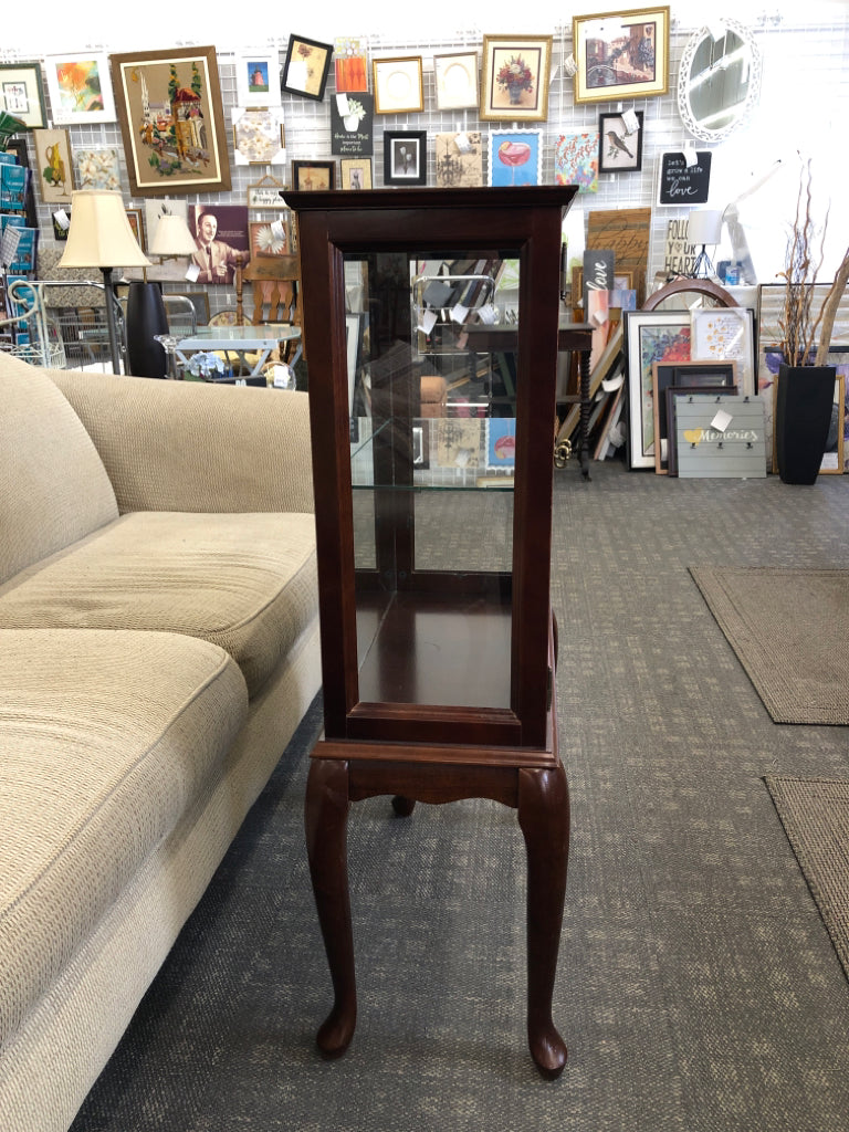 SMALL CHERRY WOOD CABINET W GLASS SHELVES AND DOORS.