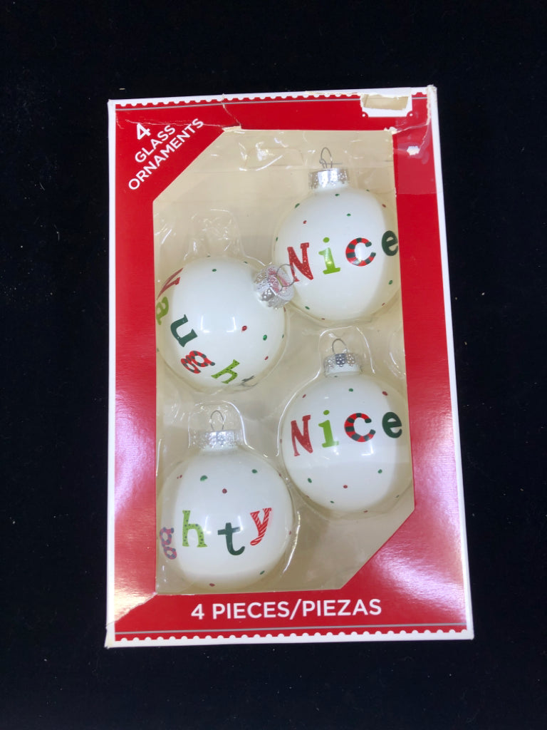 4 GLASS NAUGHTY NICE ORNAMENTS IN BOX.