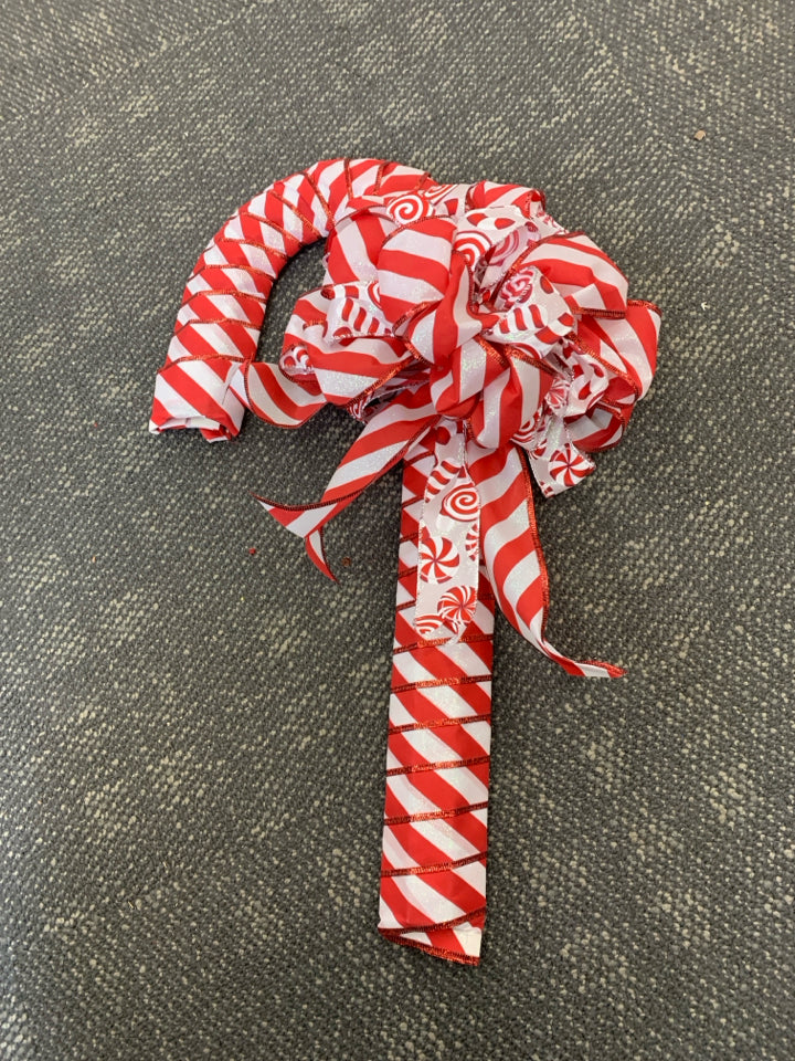 RED RIBBON CANDY CANE WALL HANGING.