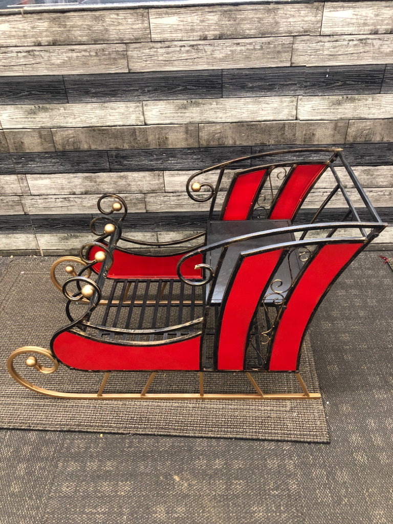DISTRESSED METAL AND STAINED GLASS SLEIGH.