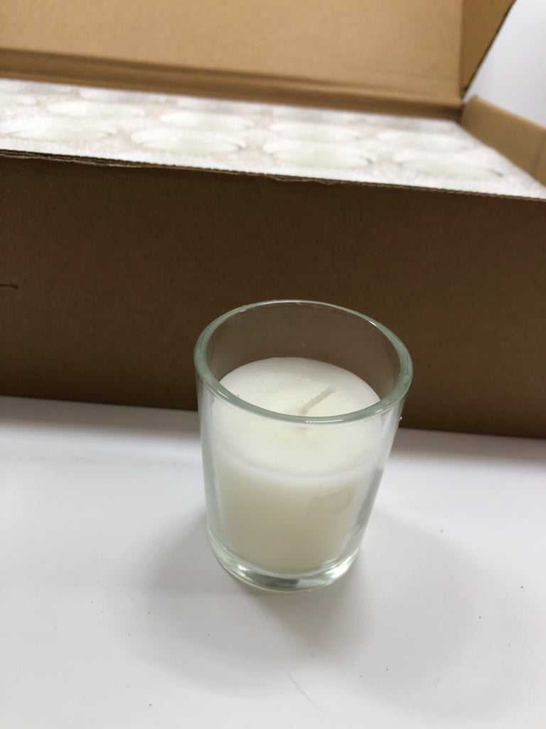 NIB 24PK UNSCENTED CLEAR GLASS VOTIVE CANDLES.