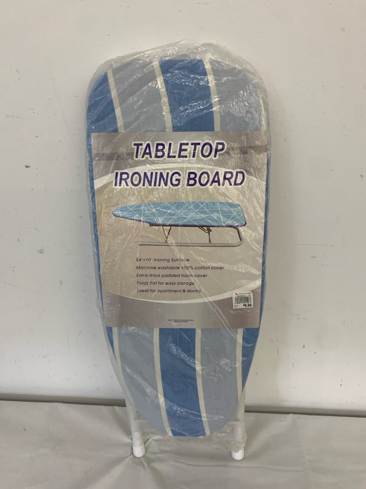 NIP IRONING BOARD.