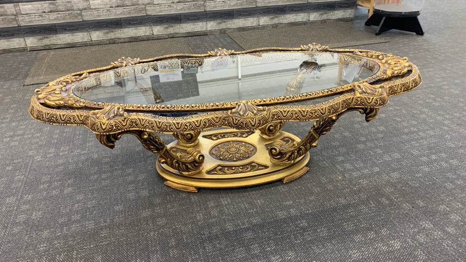 ORNATE GOLD COFFEE TABLE W/GLASS CENTER.