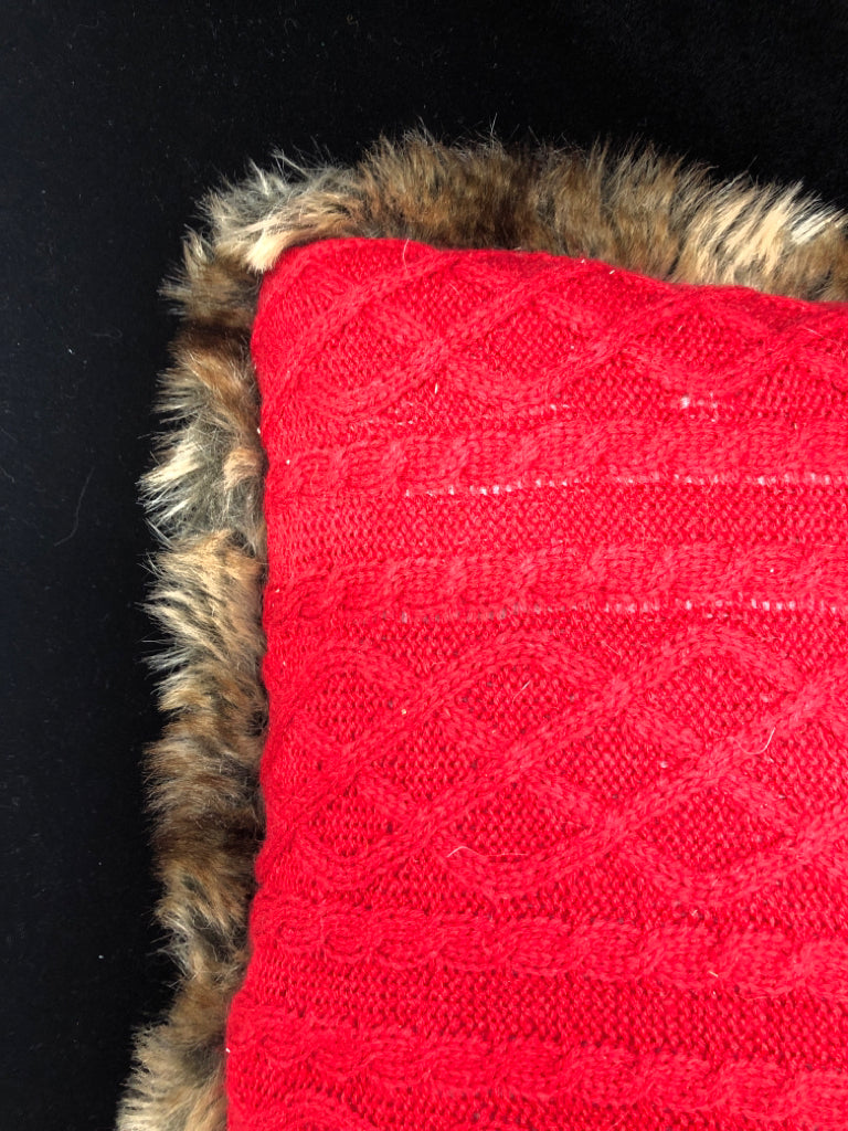 RED SWEATER PILLOW W/ FAUX FUR EDGE.