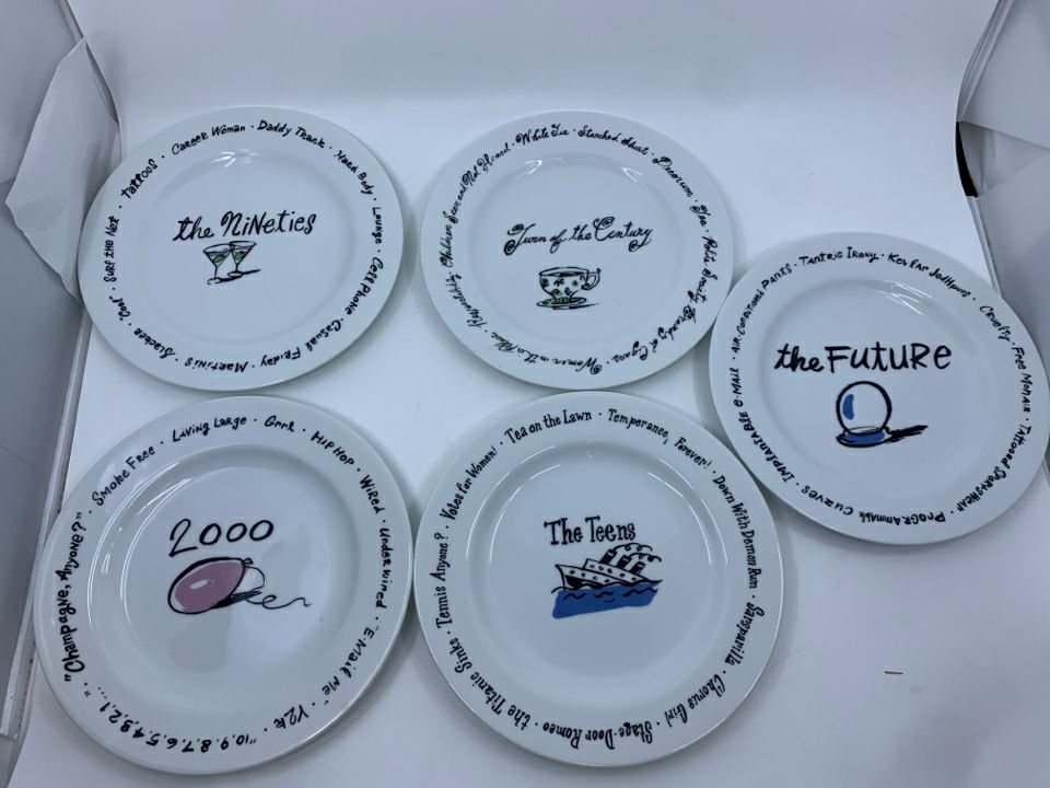 12 POTTERY BARN MILLENNIUM DECADES PLATES.