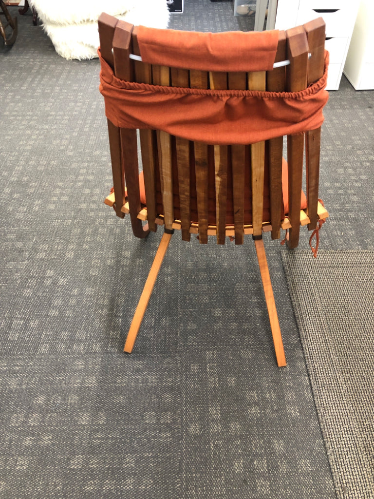 ARTISAN MADE TEAK WOOD FOLDABLE CHAIR W/ BURNT ORANGE CUSHIONS.