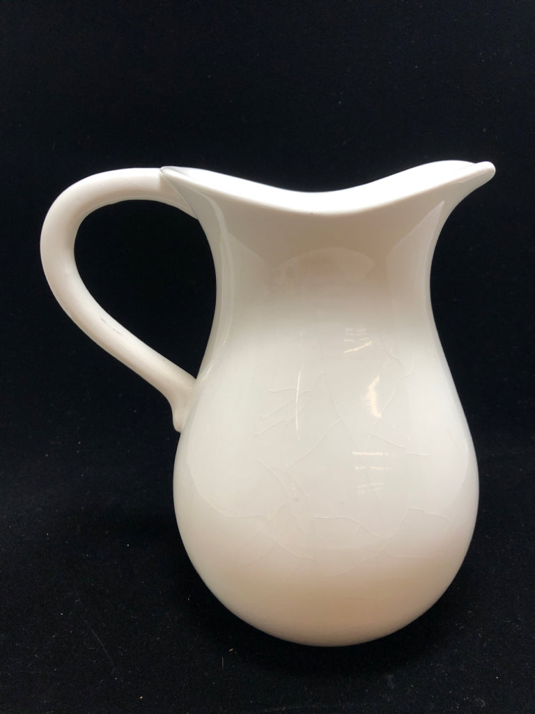 WHITE CERAMIC PITCHER.
