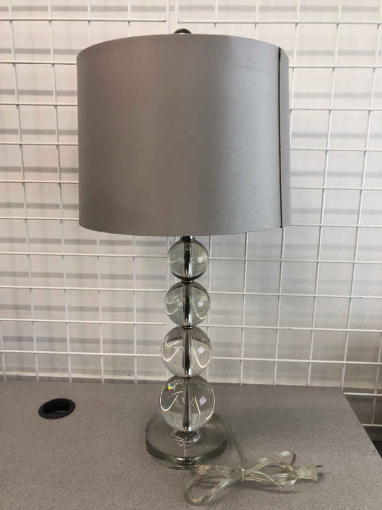 GLASS BALL BASE LAMP W/GREY SHADE.