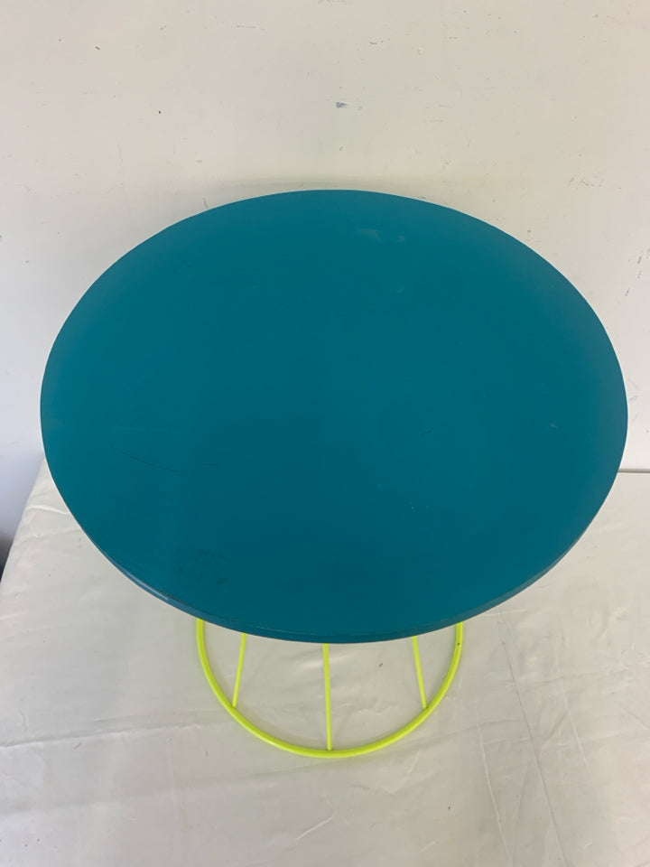 SMALL TEAL TOP NEON GREEN TABLE.